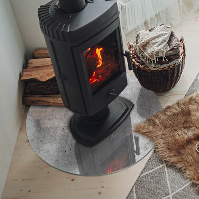 Plaque verre ronde sous poêle structure en béton brut