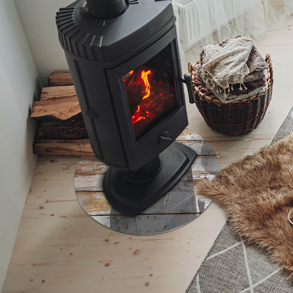 Plaque verre ronde sous poêle planche en bois rouillée