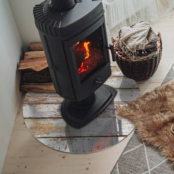 Plaque verre ronde sous poêle planche en bois rouillée