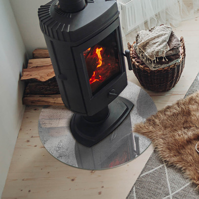 Plaque de sol ronde en verre cheminée Texture de béton dans un style brut