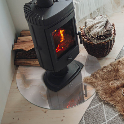 Plaque de sol ronde en verre cheminée motif organique en pierre