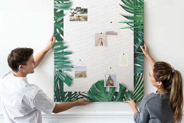 Tableau de liège Feuilles tropicales entourées d'un cadre blanc