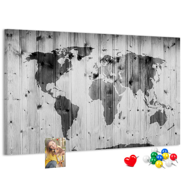 Tableau de liège Une carte du monde sur un fond de planches de bois