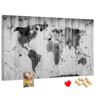 Tableau de liège Une carte du monde sur un fond de planches de bois