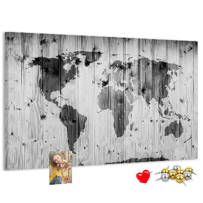 Tableau de liège Une carte du monde sur un fond de planches de bois