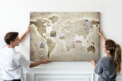 Tableau de liège Une carte du monde à l'ancienne en arrière-plan.