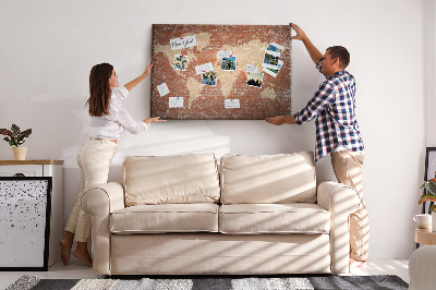 Tableau affichage liège Une carte du monde contre un mur de briques