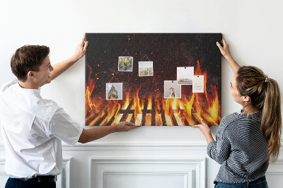 Tableau en liège Feux brûlants sur fond de grille de barbecue