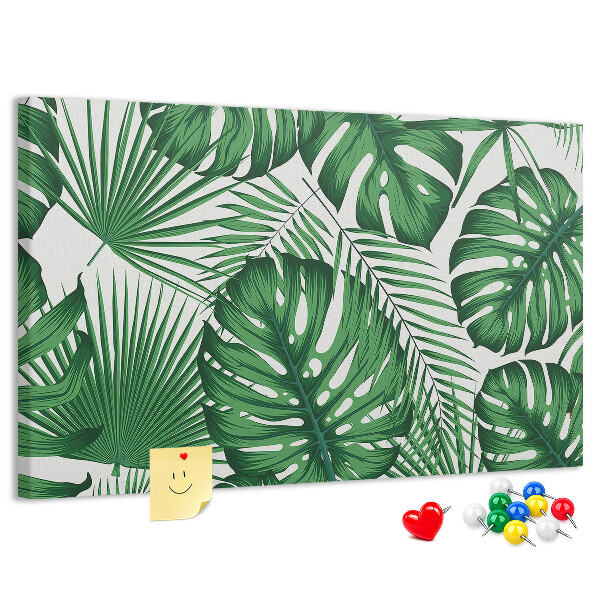 Tableau en liège De nombreuses feuilles de plantes tropicales en vert