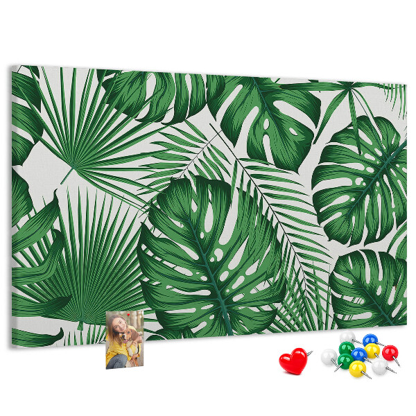 Tableau en liège De nombreuses feuilles de plantes tropicales en vert