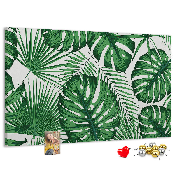 Tableau en liège De nombreuses feuilles de plantes tropicales en vert