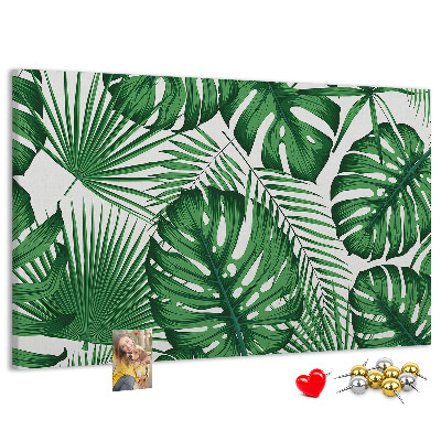 Tableau en liège De nombreuses feuilles de plantes tropicales en vert