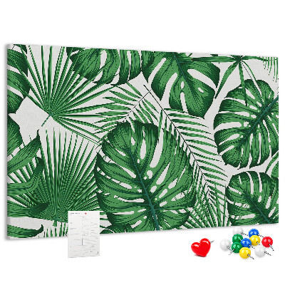 Tableau en liège De nombreuses feuilles de plantes tropicales en vert