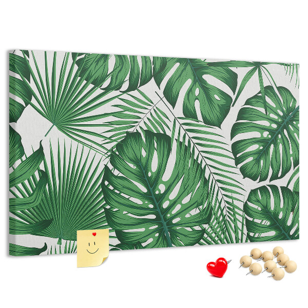 Tableau en liège De nombreuses feuilles de plantes tropicales en vert