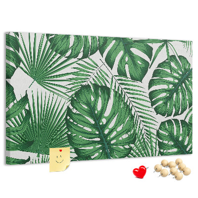 Tableau en liège De nombreuses feuilles de plantes tropicales en vert
