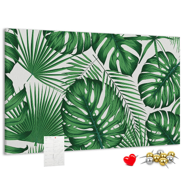 Tableau en liège De nombreuses feuilles de plantes tropicales en vert