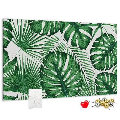 Tableau en liège De nombreuses feuilles de plantes tropicales en vert