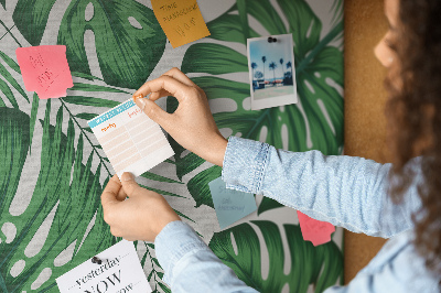 Tableau en liège De nombreuses feuilles de plantes tropicales en vert