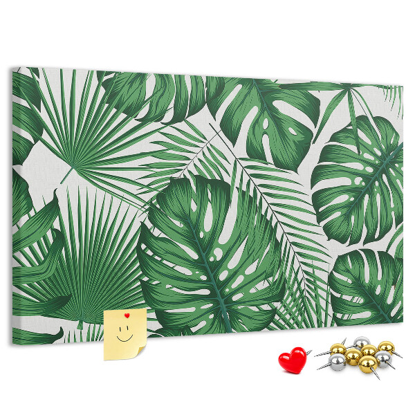 Tableau en liège De nombreuses feuilles de plantes tropicales en vert