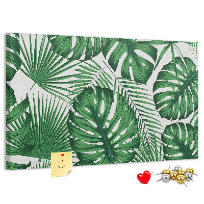 Tableau en liège De nombreuses feuilles de plantes tropicales en vert