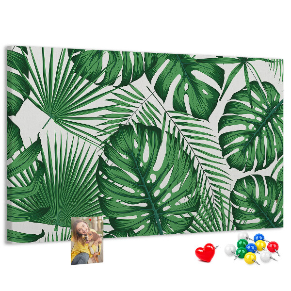 Tableau en liège De nombreuses feuilles de plantes tropicales en vert
