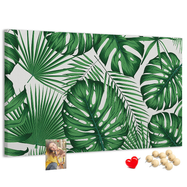 Tableau en liège De nombreuses feuilles de plantes tropicales en vert
