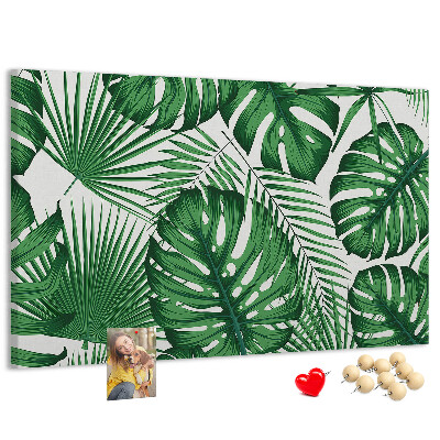 Tableau en liège De nombreuses feuilles de plantes tropicales en vert