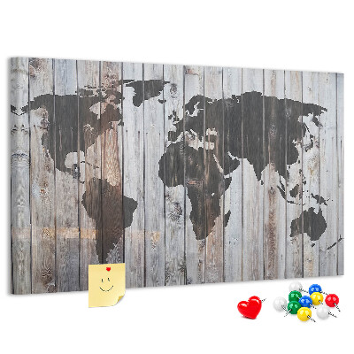 Tableau en liège Une carte du monde sur un fond de planches de bois