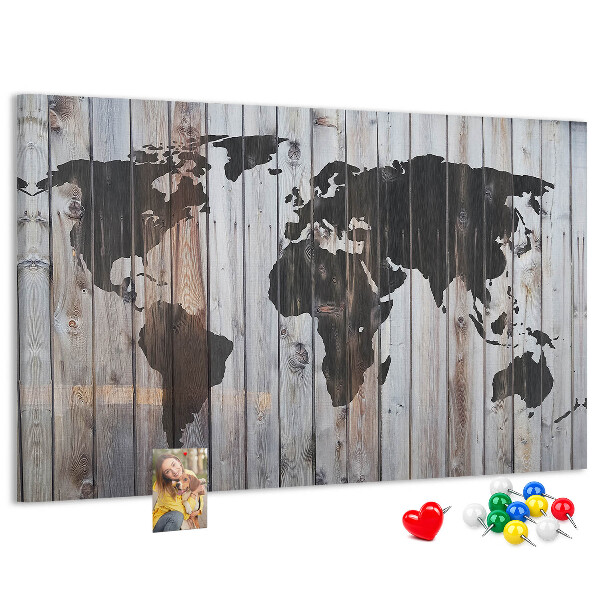 Tableau en liège Une carte du monde sur un fond de planches de bois