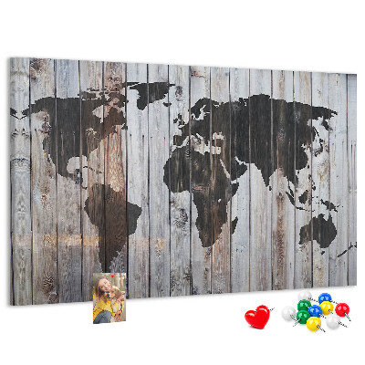 Tableau en liège Une carte du monde sur un fond de planches de bois