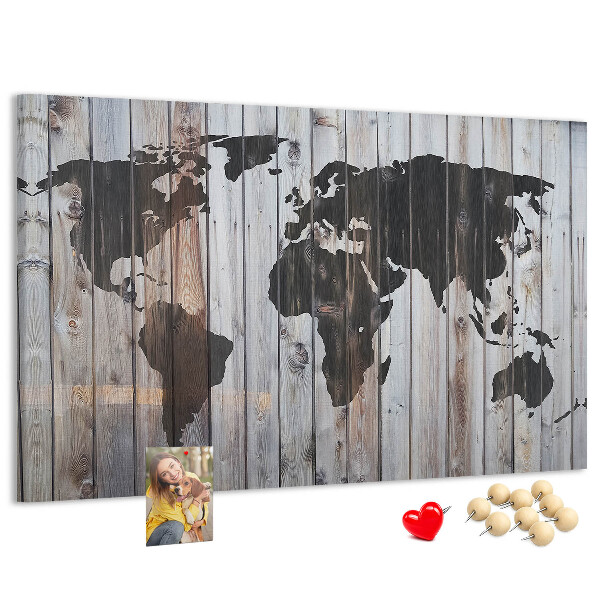 Tableau en liège Une carte du monde sur un fond de planches de bois