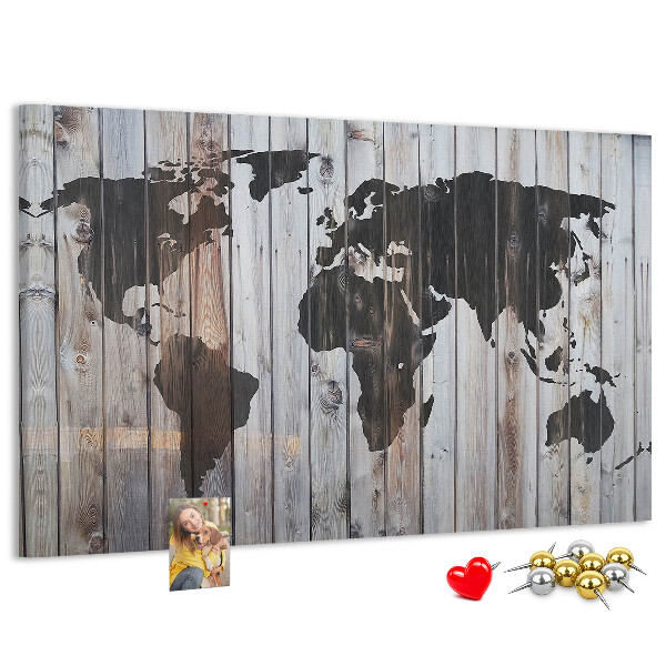 Tableau en liège Une carte du monde sur un fond de planches de bois