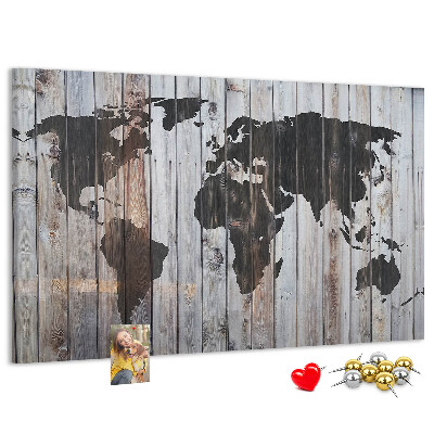 Tableau en liège Une carte du monde sur un fond de planches de bois