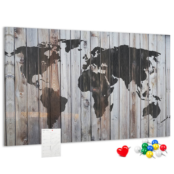 Tableau en liège Une carte du monde sur un fond de planches de bois
