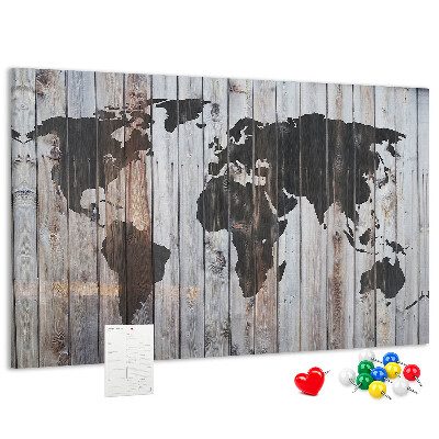 Tableau en liège Une carte du monde sur un fond de planches de bois