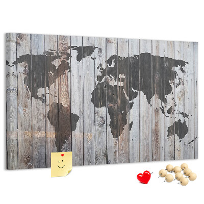 Tableau en liège Une carte du monde sur un fond de planches de bois
