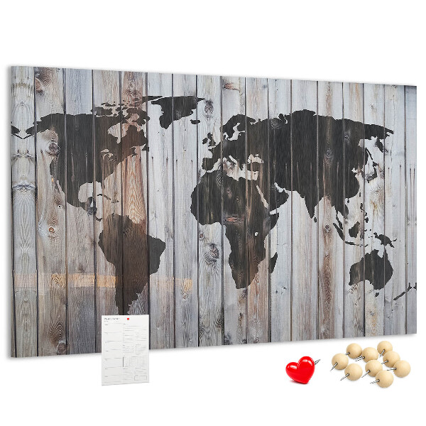 Tableau en liège Une carte du monde sur un fond de planches de bois