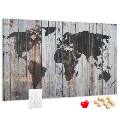 Tableau en liège Une carte du monde sur un fond de planches de bois