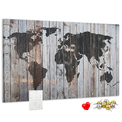 Tableau en liège Une carte du monde sur un fond de planches de bois