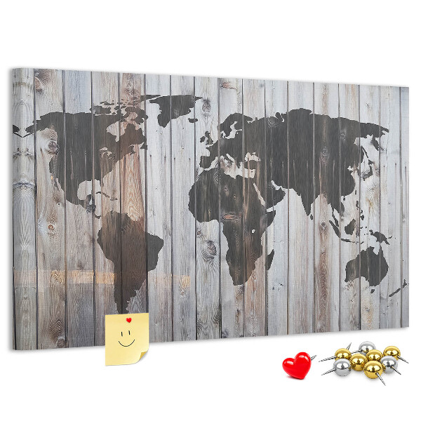Tableau en liège Une carte du monde sur un fond de planches de bois