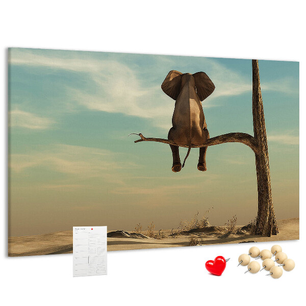Tableau affichage liège Un éléphant sur une branche dans un paysage désertique
