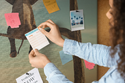Tableau affichage liège Un éléphant sur une branche dans un paysage désertique