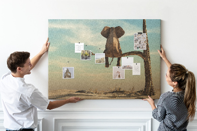 Tableau affichage liège Un éléphant sur une branche dans un paysage désertique