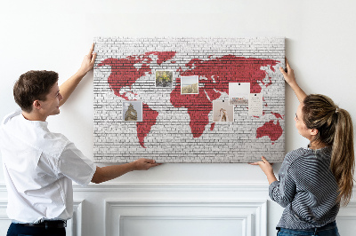 Tableau affichage liège Contour rouge du monde sur un mur de briques