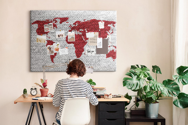 Tableau affichage liège Contour rouge du monde sur un mur de briques