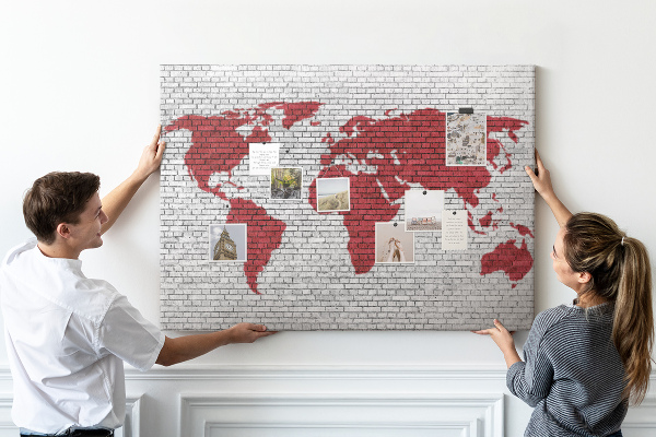 Tableau affichage liège Contour rouge du monde sur un mur de briques