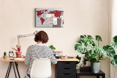 Tableau affichage liège Contour rouge du monde sur un mur de briques