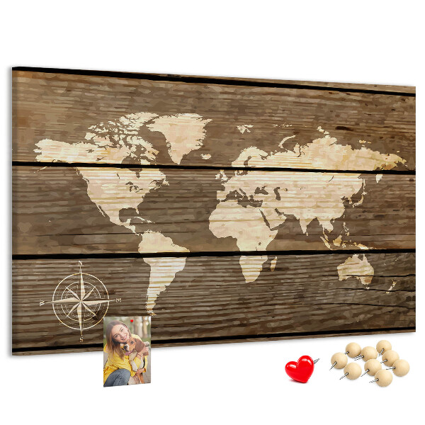 Tableau en liège Une carte du monde sur un fond de planches de bois