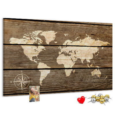 Tableau en liège Une carte du monde sur un fond de planches de bois