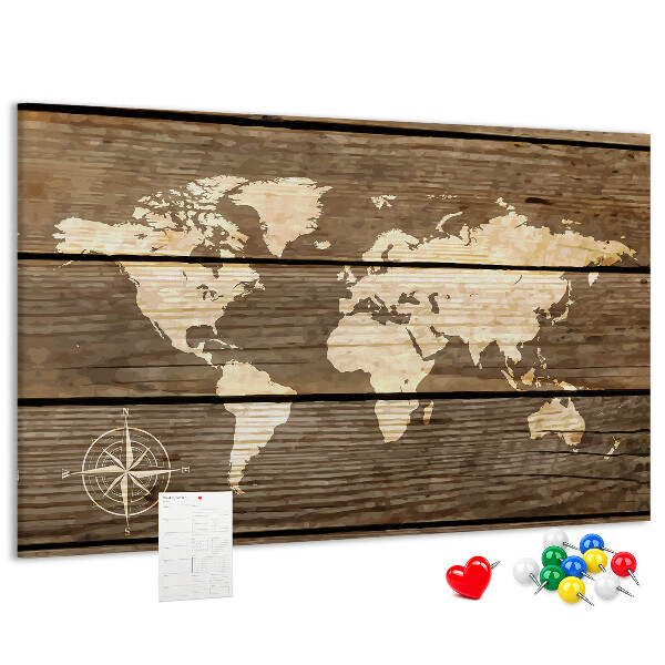 Tableau en liège Une carte du monde sur un fond de planches de bois